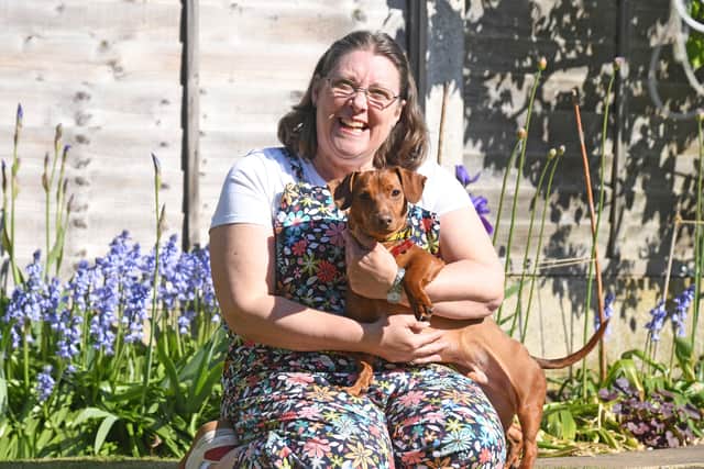 Lindy Fox has fostered 100 dogs with the Dogs Trust, with Nacho becoming her century foster - and now, a trip to Buckingham Palace.