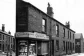 Two boys stand next to a grocers and confectioners on Main Road in August 1966. Bright Terrace can seen in the background.