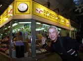 Neil Goodwin on his stall, 'England's Lowest Prices',   at Leeds Market, in 1998
