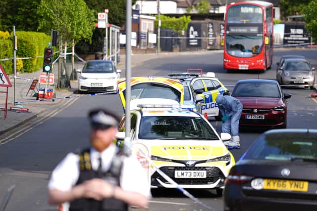 Police officers at the scene in Golders Green, north-west London, after two men - one aged in his 70s and another in his 30s - were stabbed on Wednesday morning  