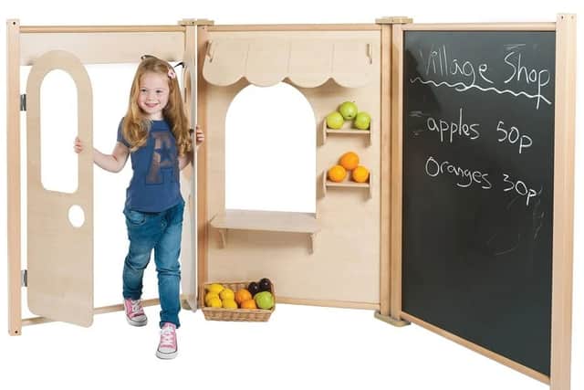 Featuring a chalkboard and an opening door, this play set is justifiably popular