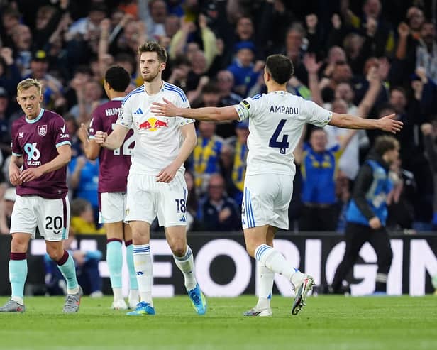 KEY: Leeds United midfielder Anton Stach celebrates his brilliant opener against Burnley as captain Ethan Ampadu  shows his approval.