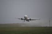 A passenger jet takes off from Leeds Bradford Airport  on 21 December 2023.