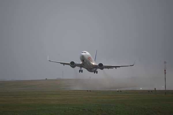 A passenger jet takes off from Leeds Bradford Airport  on 21 December 2023.