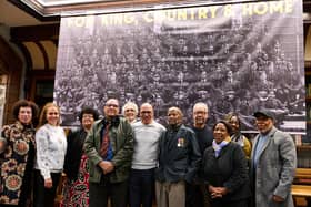 The city's last surviving Caribbean World War Two RAF veteran, Alford Gardner (1926-2024), front centre wearing his medals, with veterans' relatives at the 2023 For King, Country & Home exhibition.