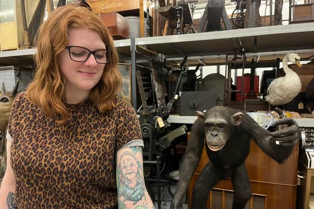 Sarah Burhouse, Leeds Museums and Galleries’ curator of natural sciences, with her Sir David Attenborough tattoo near one of the exhibitions celebrating the legend's 100th birthday.
