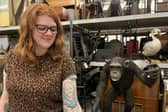 Sarah Burhouse, Leeds Museums and Galleries’ curator of natural sciences, with her Sir David Attenborough tattoo near one of the exhibitions celebrating the legend's 100th birthday.