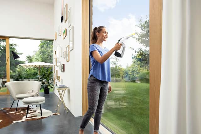 Just spray on some detergent, vacuum it off, and you'll have shiny windows in seconds