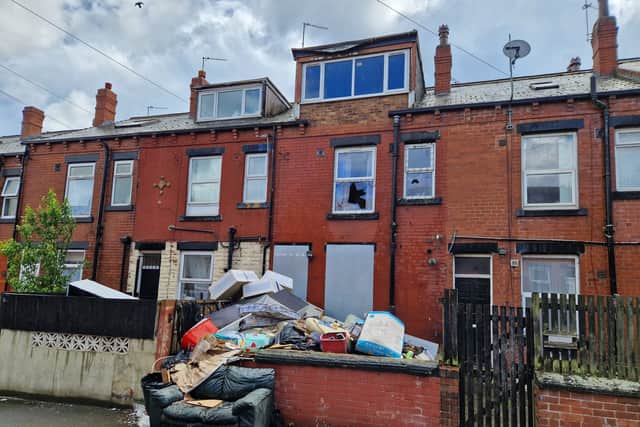 Young people have been seen climbing on the rubbish pile and smashing the windows with stones, neighbours said.