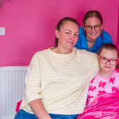 Danielle Hedley with her daughter Ruby pictured at home in Middleton, Leeds with nurse specialist Hannah Crawford, centre.