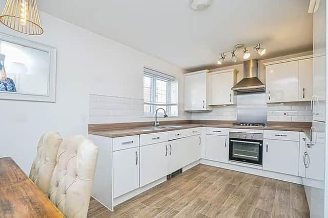 The spacious dining kitchen gives the home a bright, practical hub for everyday family life