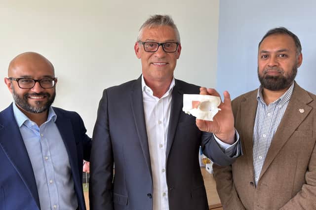 (left to right) Maxillofacial Surgeon Mr Jiten Parmar, patient Andrew Wood holding a bespoke 3D printed model of his eye socket, and Consultant neurosurgeon Asim Sheikh   at Leeds Teaching Hospitals NHS Trust