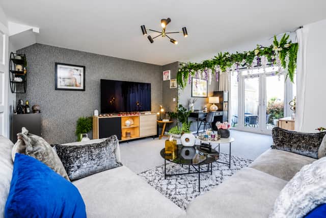 Floor-to-ceiling windows help flood the spacious reception room with natural light throughout the day
