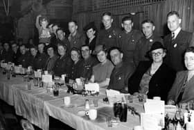 Guests at a lunch in Leeds Town Hall. This event was organised by the Yorkshire Evening News POW club for men who had returned in 1943. Some of them are seen here with their families.