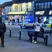 Main Street in Garforth was cordoned off as a man was taken to hospital with a serious leg injury.