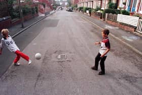 Liall Bolens and Chris McQuade play football on Methley Terrace before Transport 2000 and the local residents turfed the street.