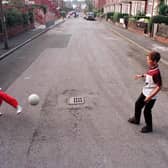 Liall Bolens and Chris McQuade play football on Methley Terrace before Transport 2000 and the local residents turfed the street.