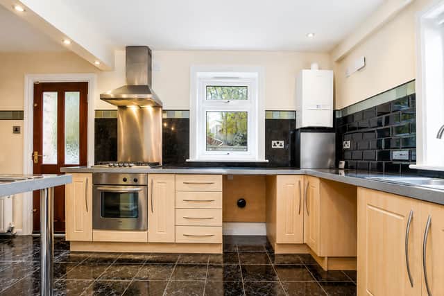 The recently updated kitchen brings a modern finish to the heart of this spacious family home
