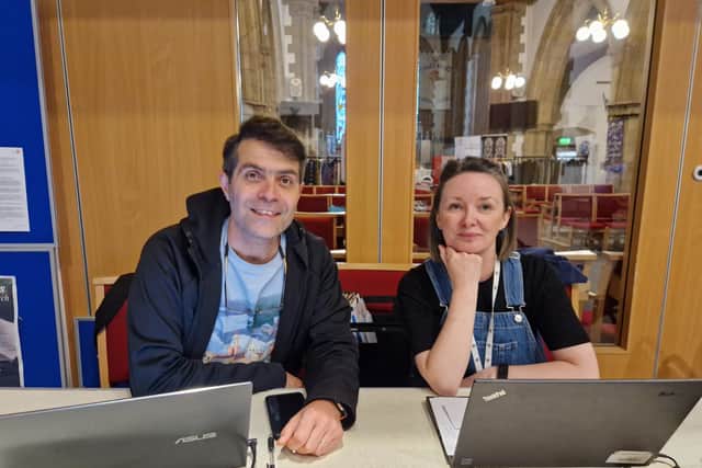 Reza Madadi and Kat Morley-Yates on the help desk at Meeting Point.