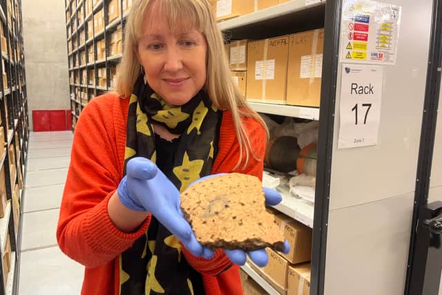 Kat Baxter, Leeds Museums and Galleries’ curator of archaeology, with ancient artefacts discovered inside a Bronze Age burial mound in Leeds.