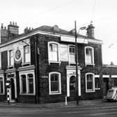 The Junction Hotel at the corner of Dewsbury Road and Moor Road pictured in December 1958.  On the far left at number 135 Dewsbury Road is W. Murrell's gents hairdressing saloon. 