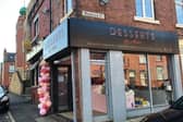 Enforcement action has been taken by Leeds City Council on Desserts by Akbar over the store frontage being out of keeping with the area.