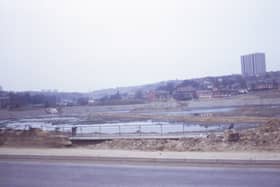 Looking from Tong Road onto a site being developed into a reservoir, bordered by Ring Road, Farnley on the left, Butt Lane at the far end, and Pudsey Road on the right. Pictured in March 1973.