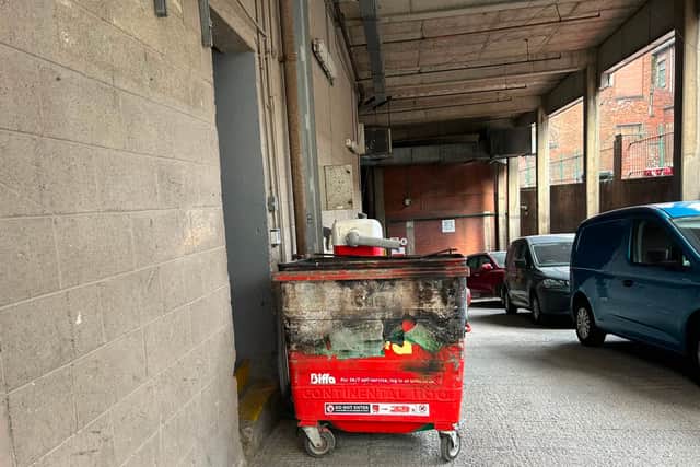 Fire crews found a burning bin near The Core.