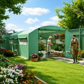The spacious walk-in greenhouse offers room for growing projects and garden storage under one roof