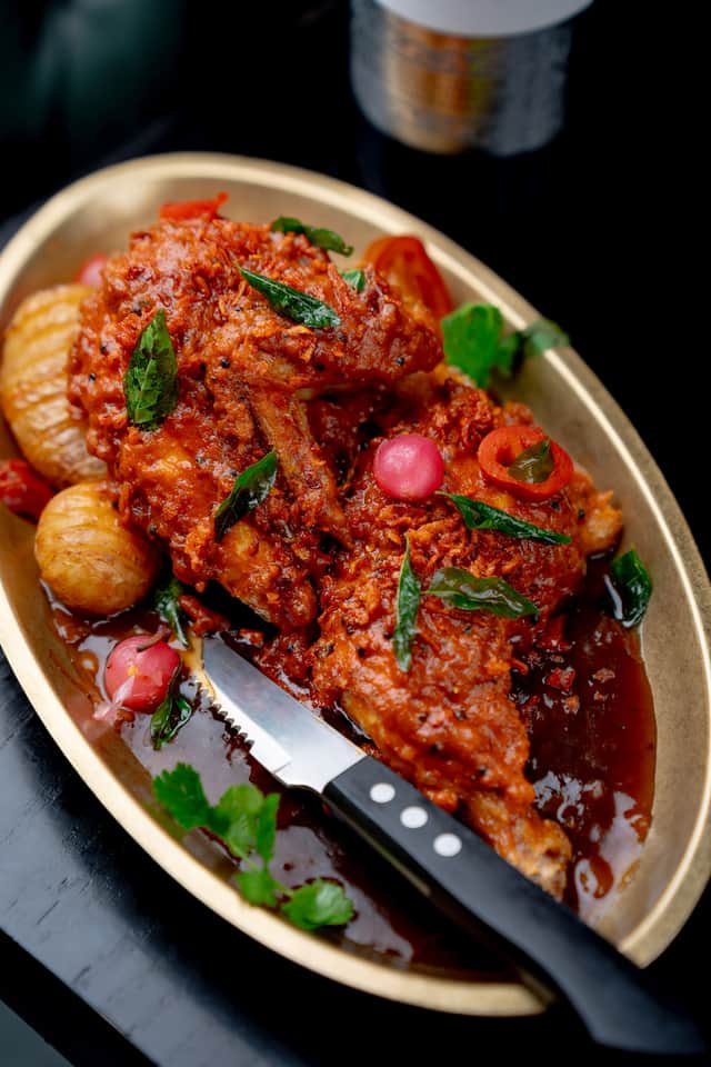 Roasted chilli garlic half chicken on bone with onion gravy