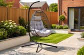The stylish dark grey hanging egg chair could become the standout feature in any patio or garden setting