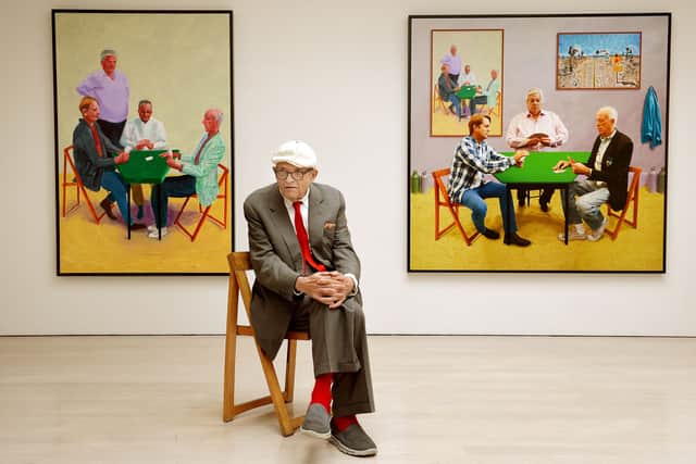 David Hockney sitting in front of his work entitled Card Players (left) and A Bigger Card Players at the launch of an Exhibition of his work called David Hockney: Painting And Photography at Annely Juda Fine Art in central London