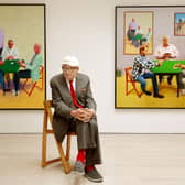 David Hockney sitting in front of his work entitled Card Players (left) and A Bigger Card Players at the launch of an Exhibition of his work called David Hockney: Painting And Photography at Annely Juda Fine Art in central London