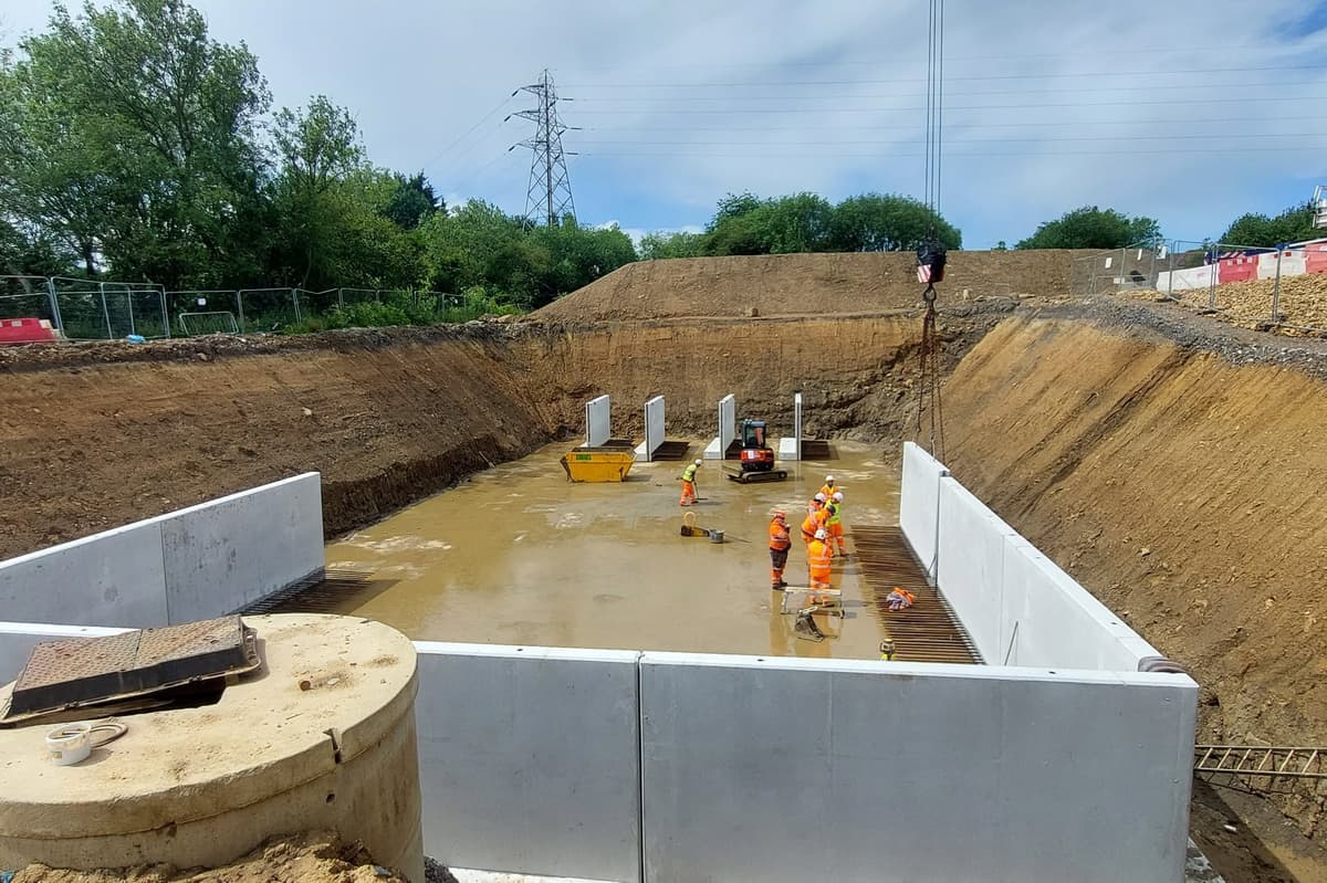 Pictures show construction of underground water tank at Dawsons Corner as ...