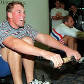 Matthew Pinsent and Steve Redgrave race each other on rowing machines at Headingley Cricket Club.