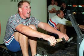 Matthew Pinsent and Steve Redgrave race each other on rowing machines at Headingley Cricket Club.