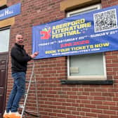 Aberford Literature Festival organiser Chris Berry smiles and points to a large promotional banner affixed to the brick wall of Aberford Village Hall - the site of a literary revolution in the making.