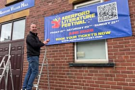 Aberford Literature Festival organiser Chris Berry smiles and points to a large promotional banner affixed to the brick wall of Aberford Village Hall - the site of a literary revolution in the making.