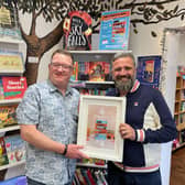 Phil Earle (right) of Hebden Bridge receiving his award after winning the Children's Fiction prize as part of the Indie Book Awards 2026.