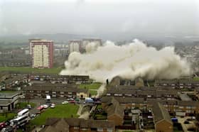 Dust cascades across the Swarcliffe estate from the remains of the two blocks of flats that were demolished in March 2001.