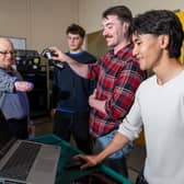 (L-R) George Glasgow with University of Leeds students Teddy Strange, Cameron Delaney, Hugo Wong. Cameron uses a digital scanner to create a 3D model of George’s residual limb, which can then be 3D printed.