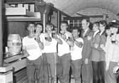 Competitors in the York Bonding Warehouse barrel race raise their glasses in July 1981