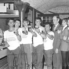 Competitors in the York Bonding Warehouse barrel race raise their glasses in July 1981