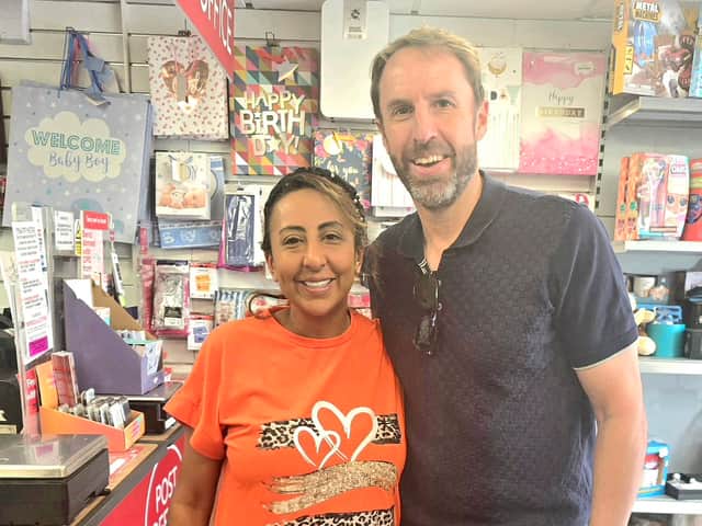 Southgate stopped for a quick photo with postmistress Ree (pictured).