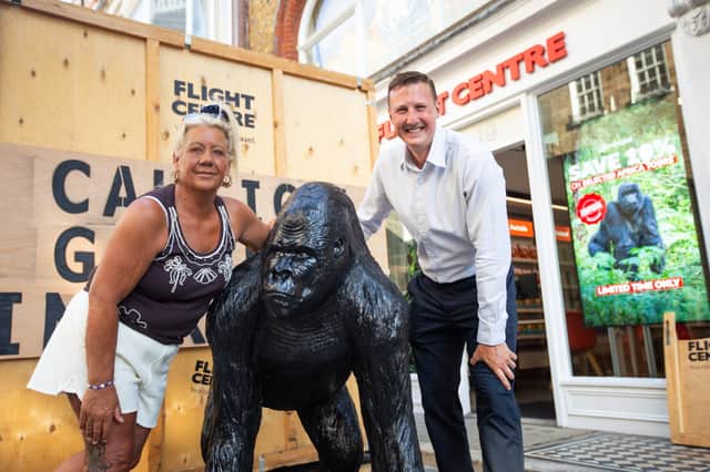 Adele Teale and Joe Beevis outside the Flight Centre store in London