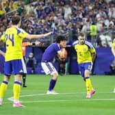 RIVALS: For once as Leeds United pair Ao Tanaka and Gabi Gudmundsson lock horns for Japan and Sweden respectively.