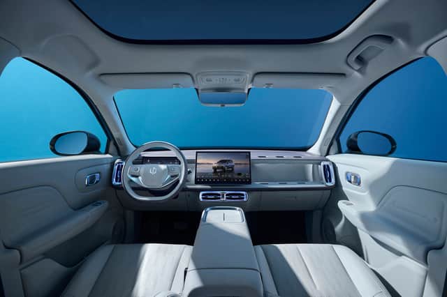 Inside, the B10 pairs a minimalist layout with a large central touchscreen and plenty of light-coloured trim