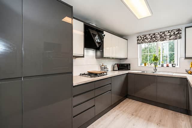 The modern fitted kitchen is supported by a separate utility room on the ground floor, helping to keep everyday household tasks organised.