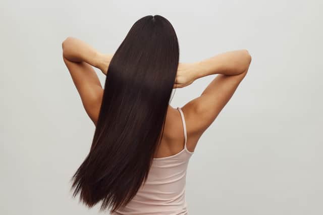 The Faszin 2-in-1 Hair Straightener combines straightening and curling functions with titanium plates