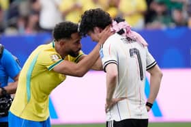 CLASS: Shown by Brazil's Manchester United striker Matheus Cunha to console Leeds United ace Ao Tanaka as Japan exit the World Cup.